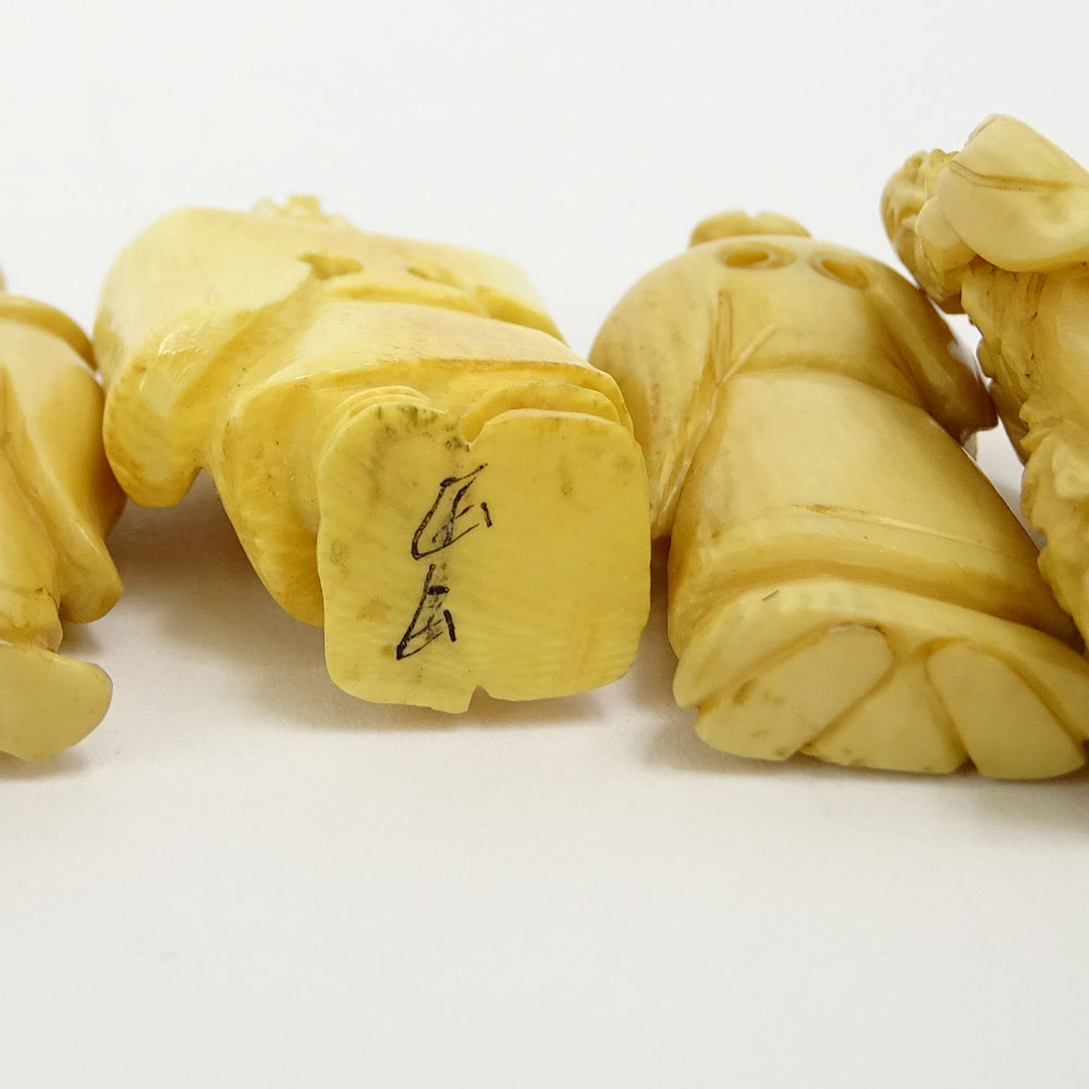 Collection of Twelve (12) Mid 20th Century Japanese Carved Ivory Netsukes.