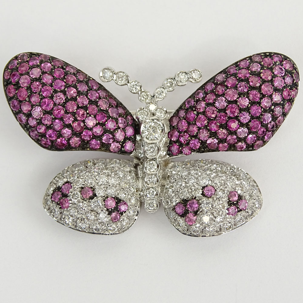 18 Karat White Gold, Round Cut Diamond and Pink Sapphire Butterfly Brooch. Diamonds G-H color, VS-SI clarity. Signed 750. Very good condition. Measures 1-1/8" H, 1-7/8" W. Approx. weight: 10.40 pennyweights. Shipping $28.00 (estimate $1500-$2000)