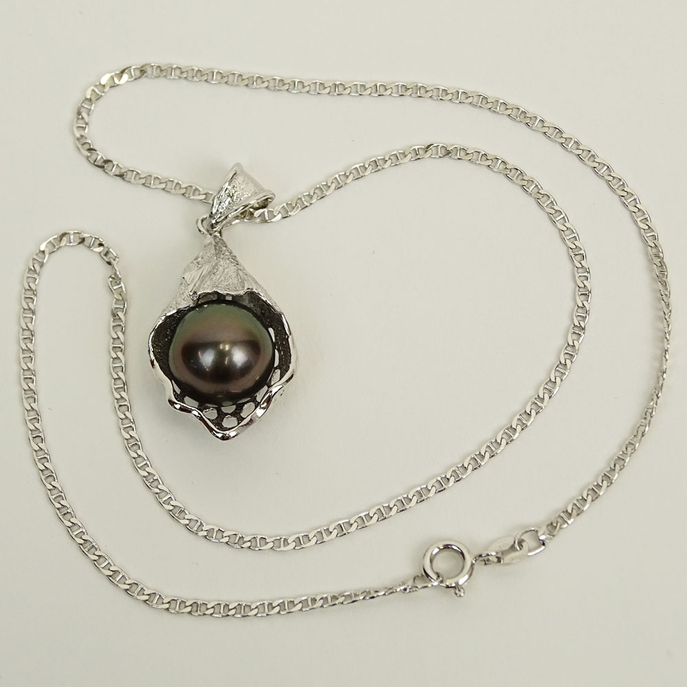 Lady's Black Pearl and Sterling Silver Pendant Necklace. Pearl measures 12.5mm.