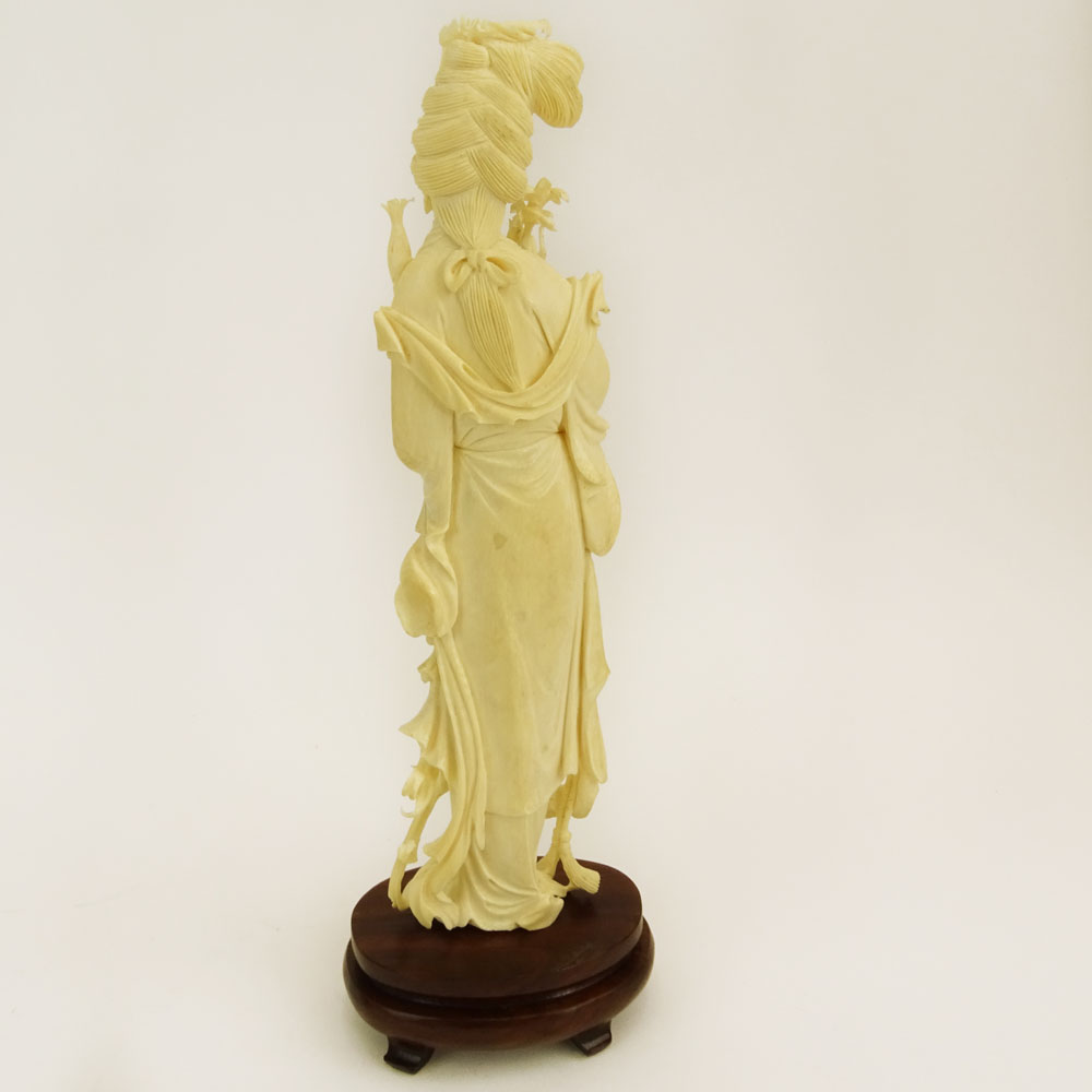 Mid 20th Century Chinese Carved Ivory Guanyin Figure on Carved Wood Base.