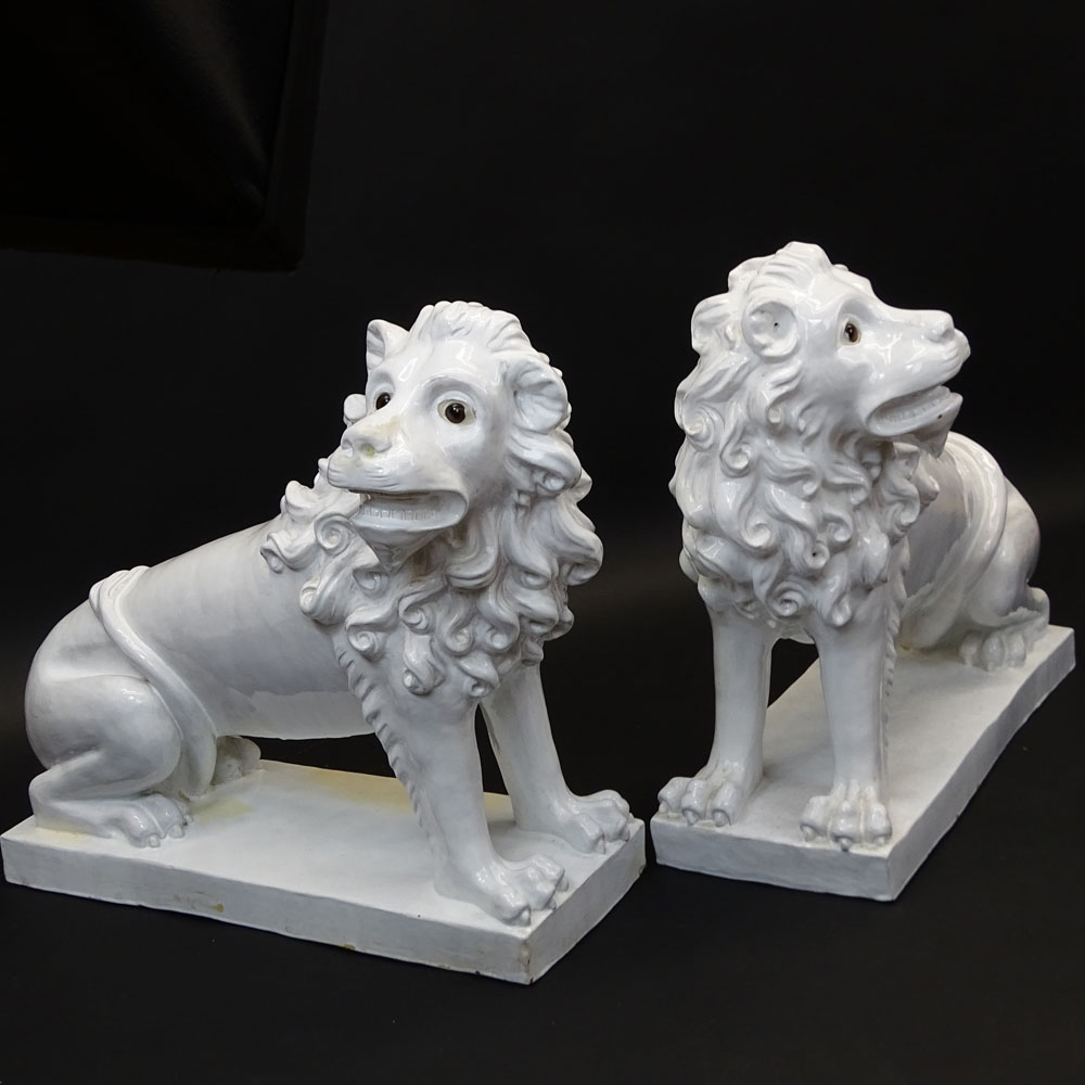 Pair of Large Vintage French White Glazed Faience Lions With Glass Eyes.