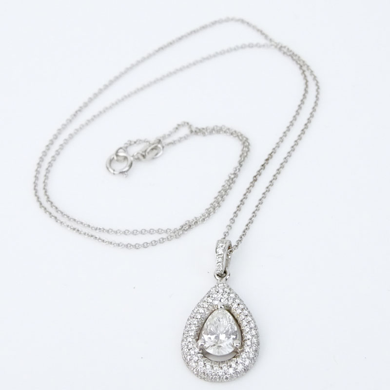 98 Carat Pear Shape Diamond and 18 Karat White Gold pendant accented with .54 Carat Round Brilliant Cut Diamonds and with 14 Karat White Gold Chain