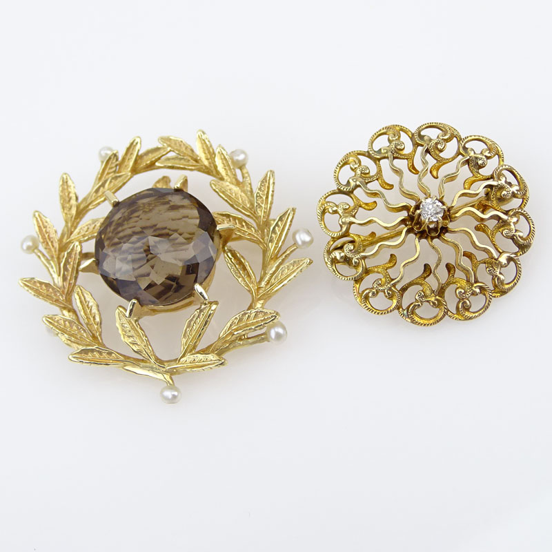 Vintage 14 Karat Yellow Gold and Small Round Cut Diamond Brooch together with a 14 Karat yellow Gold, Topaz and Seed Pearl Pendant/Brooch