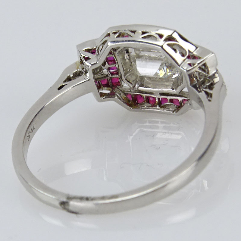 .73 Carat TW Diamond, 1.13 Carat Ruby and Platinum Ring Set in the Center with an Approx. .69 Carat Emerald Cut Diamond.