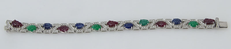 . 4.56 Carat Carved Emerald, 3.57 Carat Carved Sapphire, 5.93 Carat Carved Ruby, 1.10 Carat Round Brilliant Cut Diamond and Platinum Tutti Frutti Bracelet. 