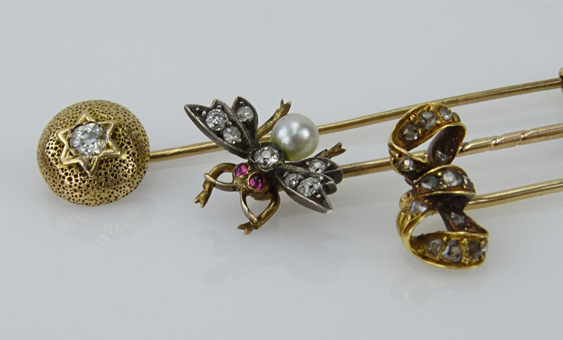 Collection of Three Victorian 10 Karat Yellow Gold Stickpins accented with Old European Cut and Mine Cut Diamonds, One with a small Pearl and Rubies