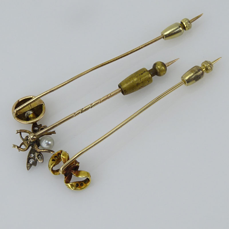 Collection of Three Victorian 10 Karat Yellow Gold Stickpins accented with Old European Cut and Mine Cut Diamonds, One with a small Pearl and Rubies