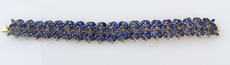 Round and Marquise Cut Sapphire and 14 Karat Yellow Gold Bracelet