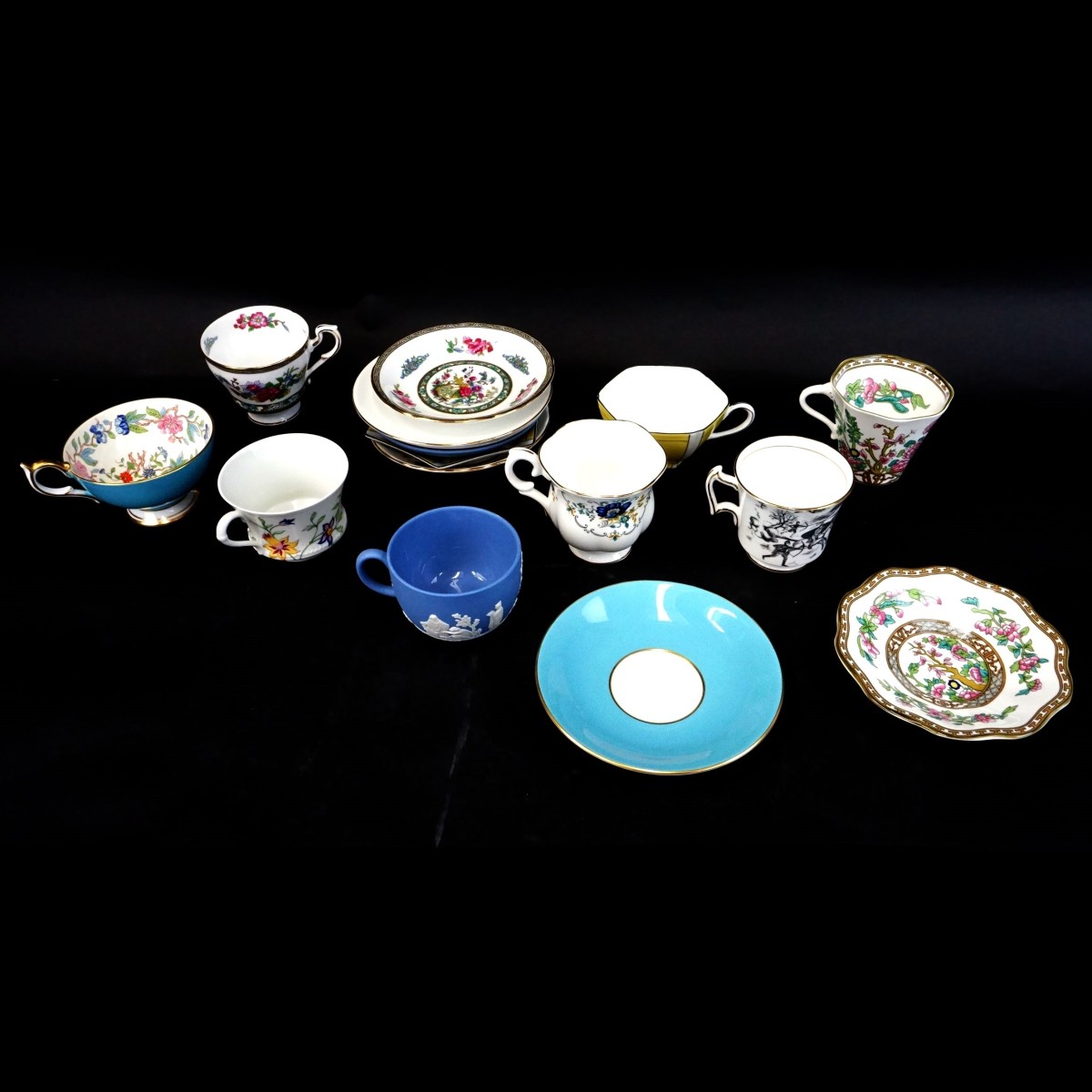 Grouping of Eight Porcelain Cups and Saucers