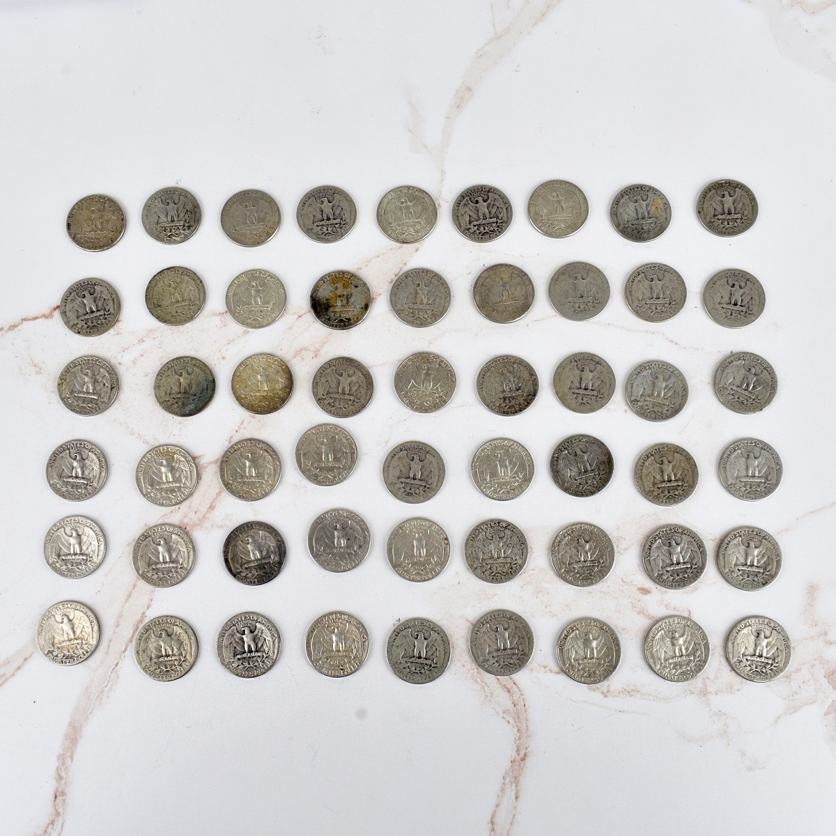 Fifty-four US Washington Silver Quarters
