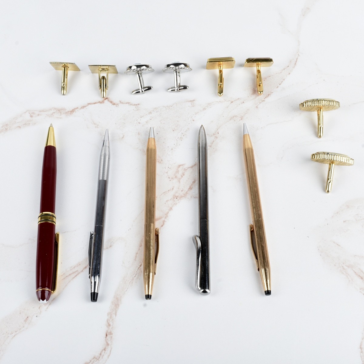 Collection of Writing Instruments and Cufflinks