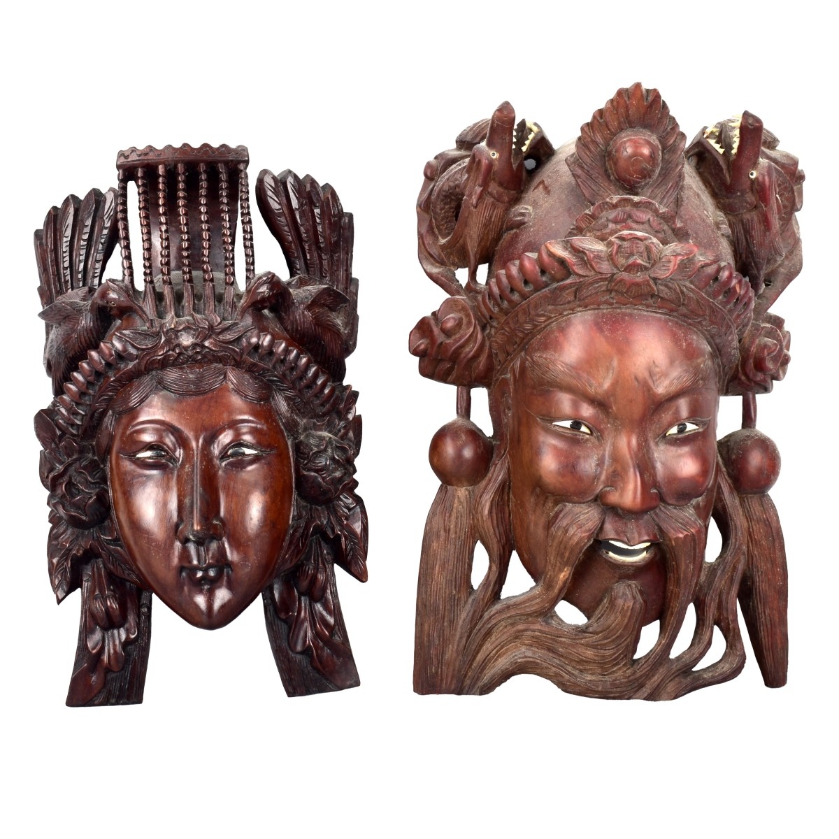 Two Carved Mask Wall Hangings