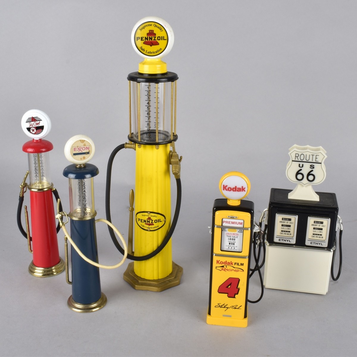Five Vintage Miniature Gasoline Pumps