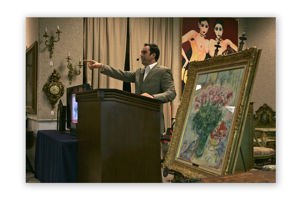 2010: Russ Kodner at the auctioneer podium as a Marc Chagall painting sells at Kodner.
