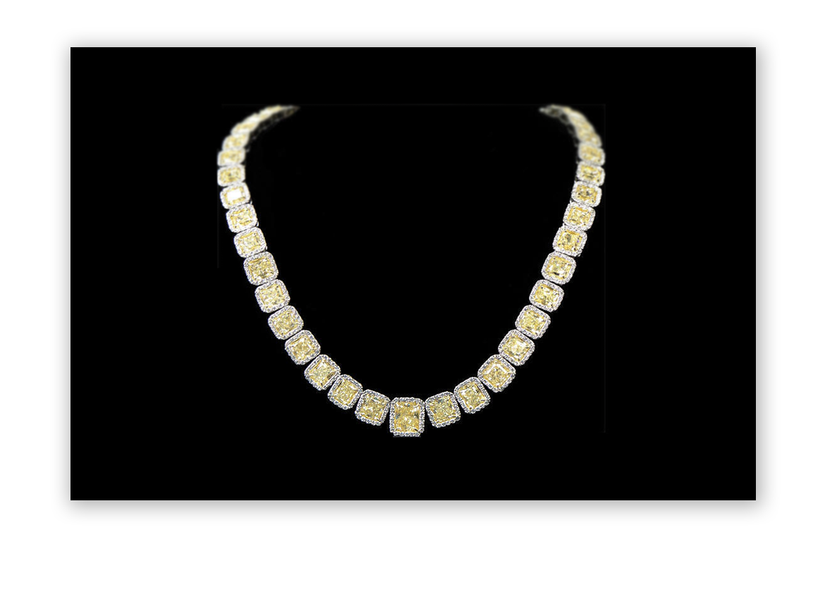 2013: 56.62 Carat Yellow Diamond Necklace hammers at $180,000 on December 18, 2013.