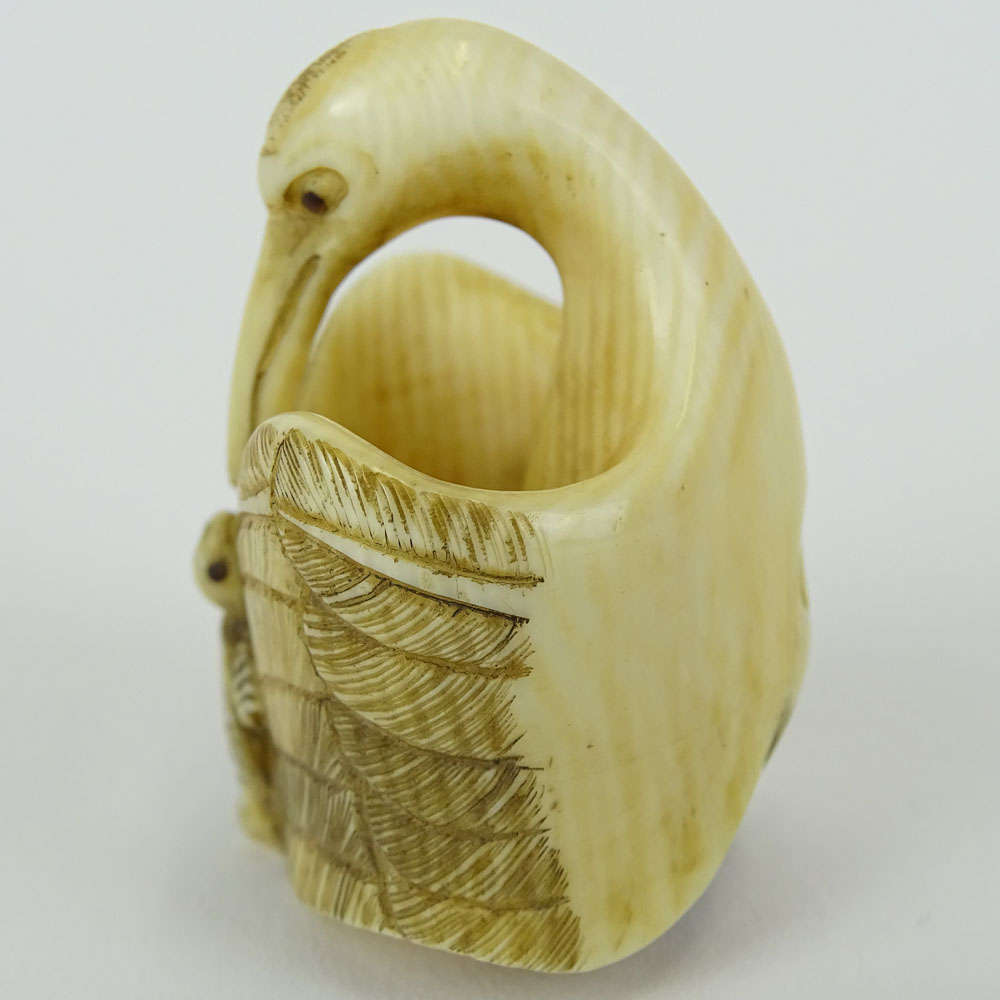 Early 20th Century Japanese Baisho Shop Carved Netsuke In The Form of a Stork and Turtle.