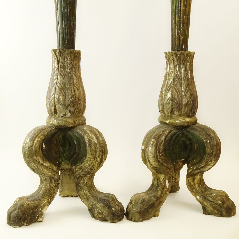 Pair of early 20th Century Italian carved painted and silver gilt candle torchieres.