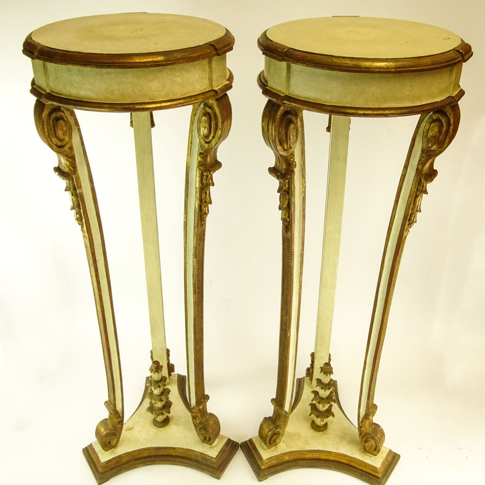 Pair of Early 20th Century probably Italian Carved Painted and Parcel Gilt Wood Pedestals.