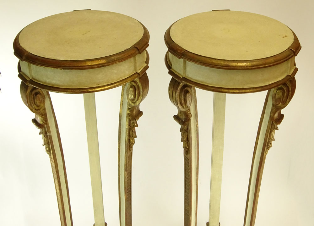 Pair of Early 20th Century probably Italian Carved Painted and Parcel Gilt Wood Pedestals.