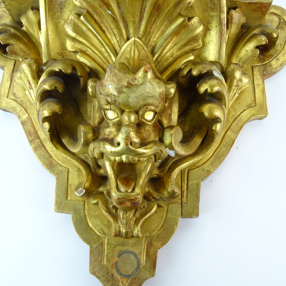 19/20th Century Carved and Gilt Wood Wall Bracket with Relief Mask and Acanthus Leaf Decoration.