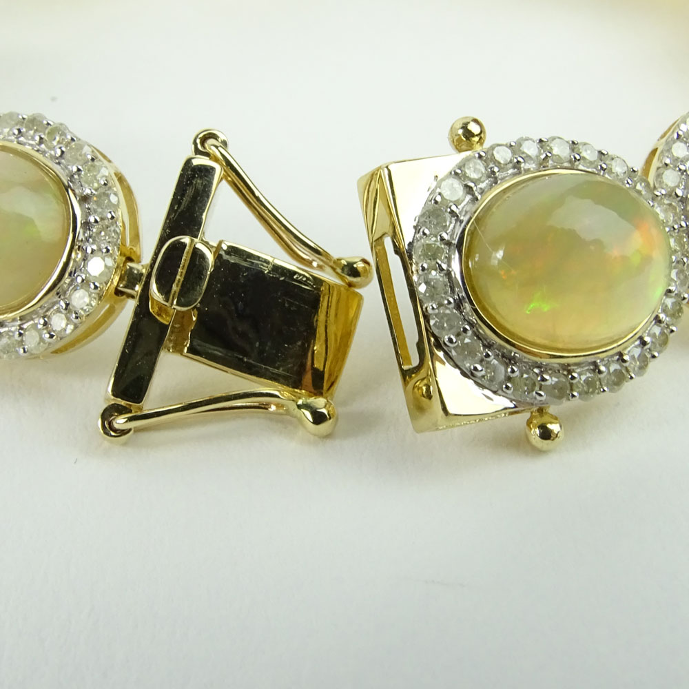 AIG Certified 18.43 Carat Cabochon Opal, 3.25 carat Round Cut Diamond and 14 Karat Yellow Gold Bracelet. 