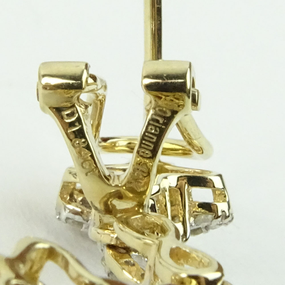 GGA Certified 13.74 Carat Oval Cut Ruby, 1.84 Carat Round Cut Diamond and 14 Karat Yellow Gold Earrings. 