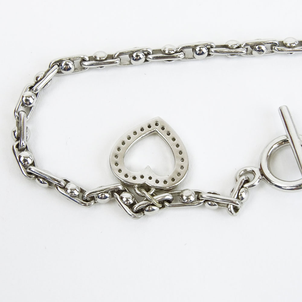 14 Karat White Gold Toggle Bracelet with Diamond Accented Heart Charm.