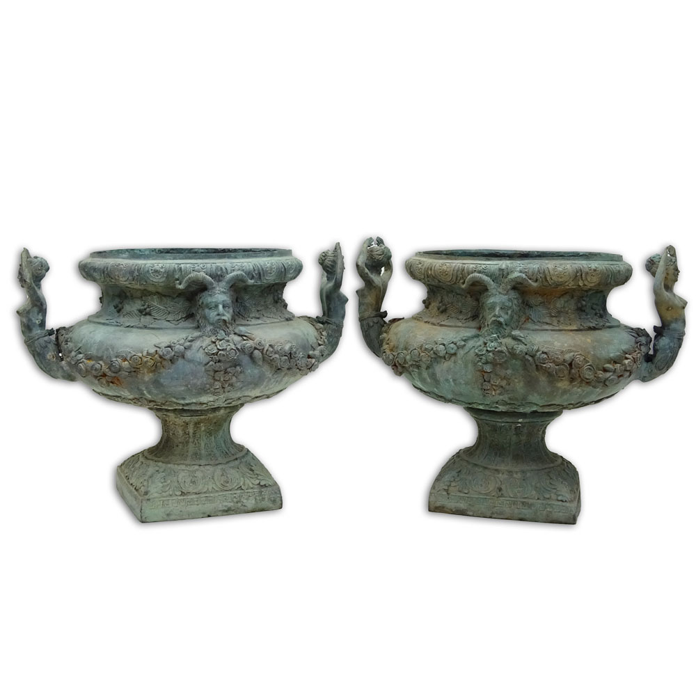 Pair of bronze jardinières with mermaid handles and figural motif.