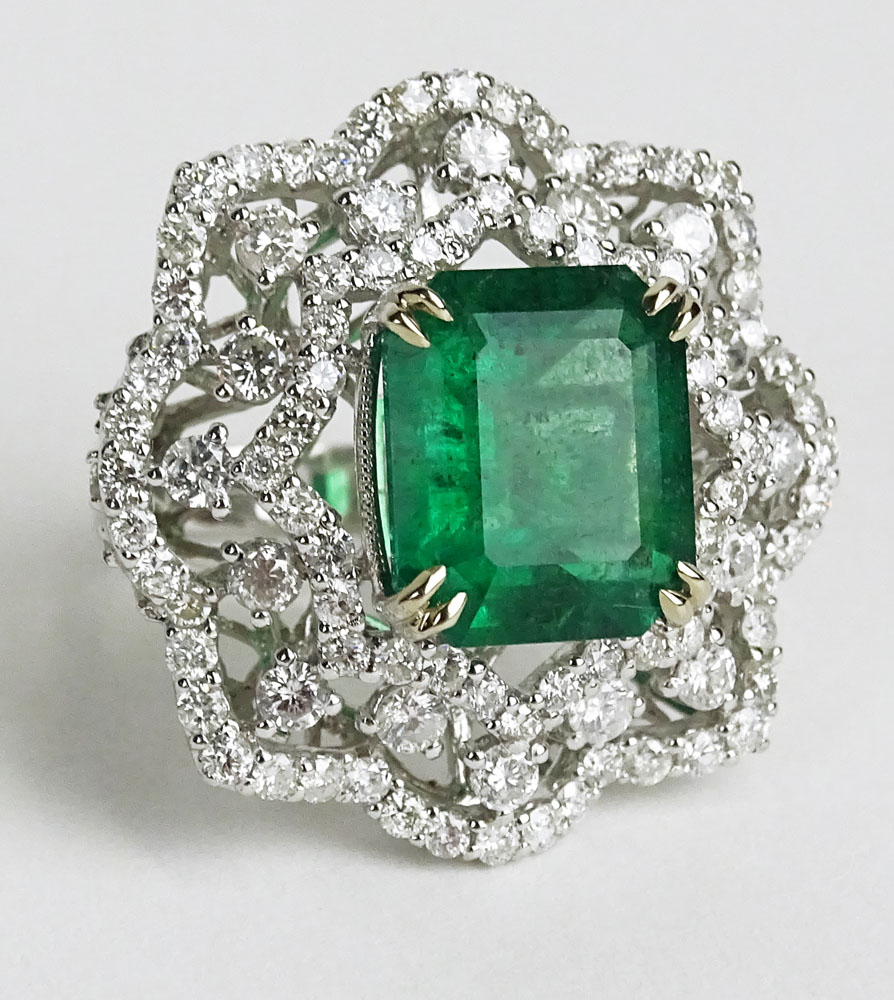 GIA Certified 7.08 Carat Octagonal Step Cut Emerald, approx. 3.72 Carat Round Cut Diamond and 18 Karat White Gold Ring. 