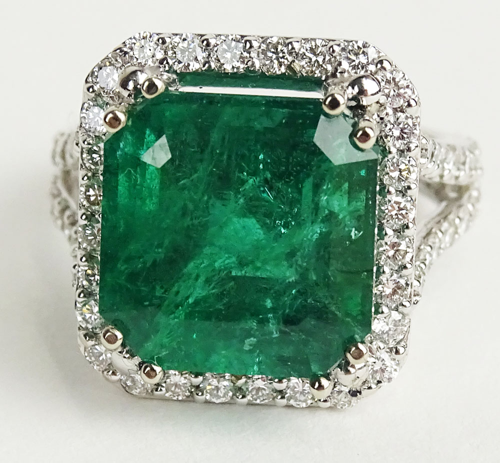 GIA Certified 9.71 Carat Octagonal Step Cut Emerald, approx. 1.21 Carat Round Cut Diamond and 18 Karat White Gold Ring. 