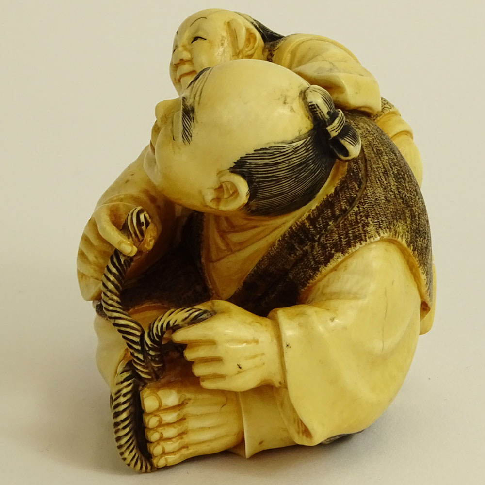Vintage Japanese Carved Ivory Figure of a Seated Man and Boy.