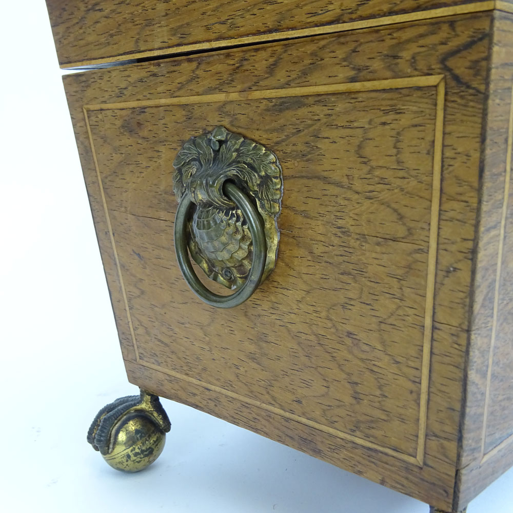 An English Regency Inlaid Rosewood Tea Caddy. Ball and claw feet, shell motif handles. 