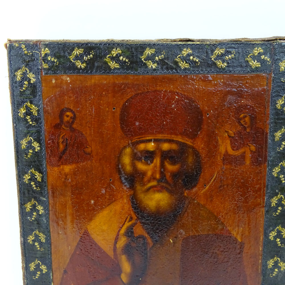 19th Century Hand Painted and Lacquered Russian Icon. Decorated with Cloth around the Exterior.