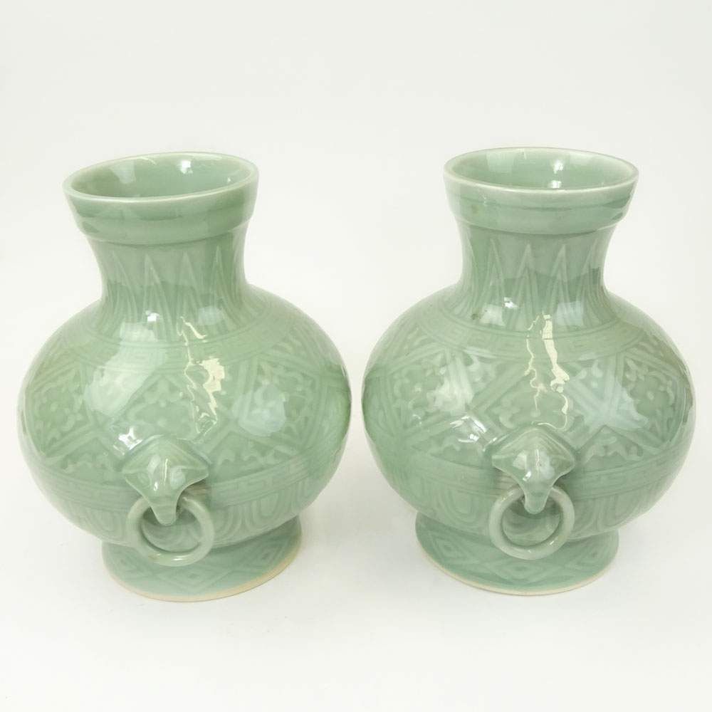 Pair of 2 Contemporary Korean Style Porcelain Figural Ring Handled Vases.