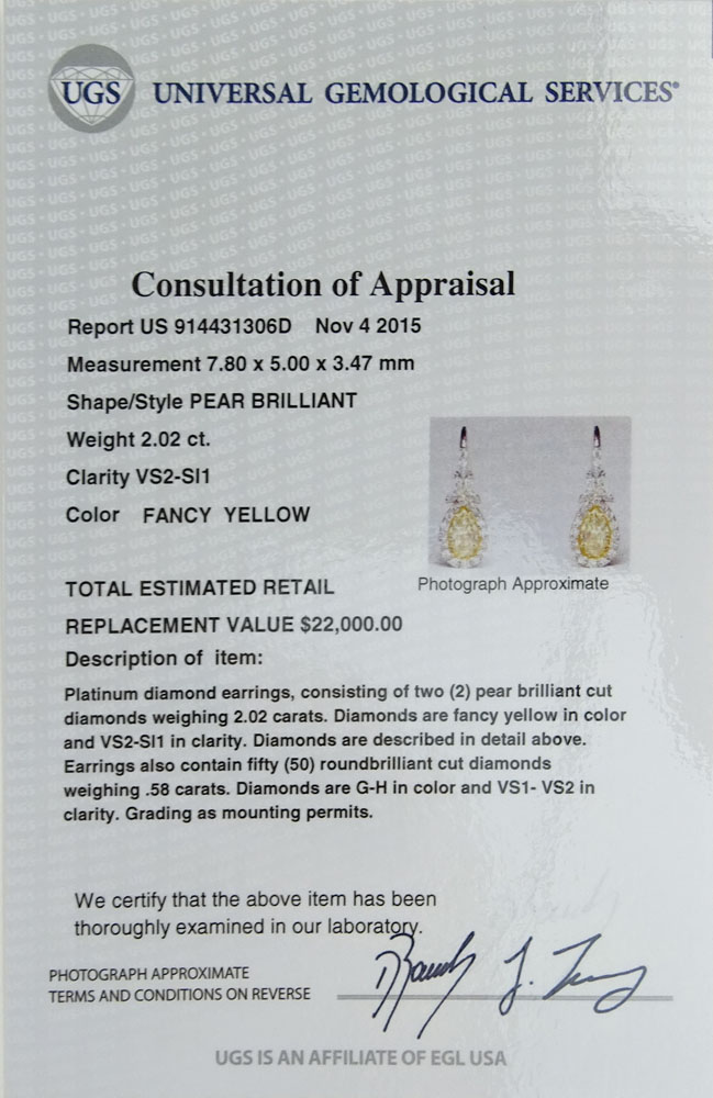 EGL Certified 2.02 Carat Pear Brilliant Cut Fancy Yellow Diamond and Platinum Earrings.