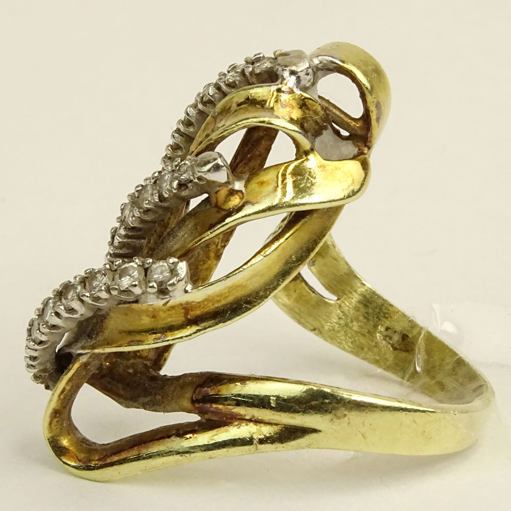 Lady's Vintage 14 Karat Yellow Gold Ring accented with small round cut diamonds.