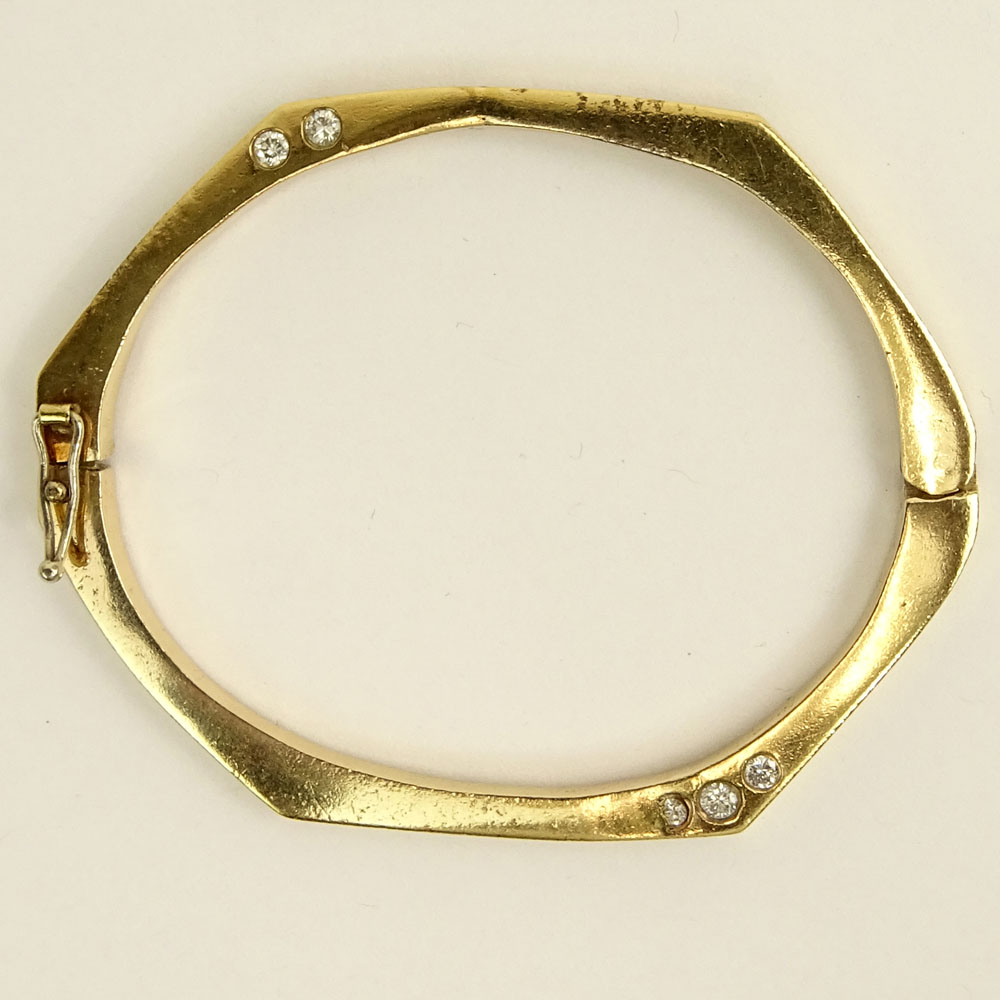 Vintage 14 Karat Yellow Gold Bangle Bracelet accented with Ten (10) Round Cut Diamonds.
