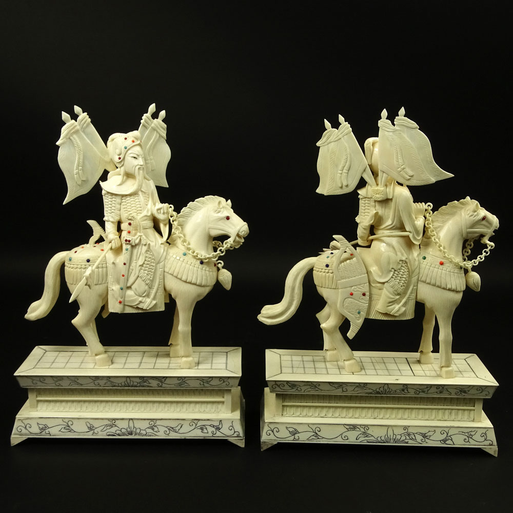 Pair of Vintage Chinese Carved Ivory Figurines "Royal Guards On Horses" Inset with turquoise and coral beads. 
