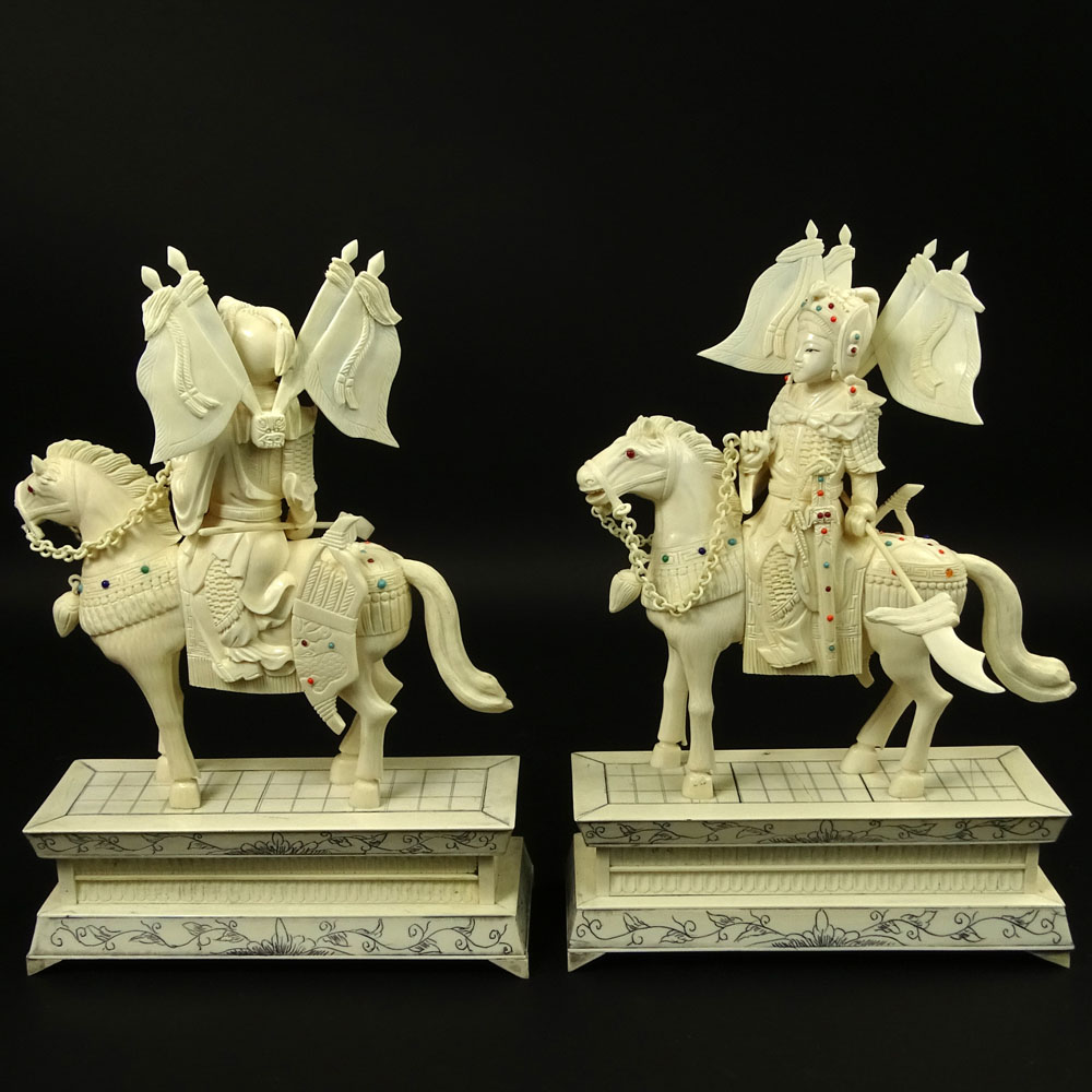 Pair of Vintage Chinese Carved Ivory Figurines "Royal Guards On Horses" Inset with turquoise and coral beads. 