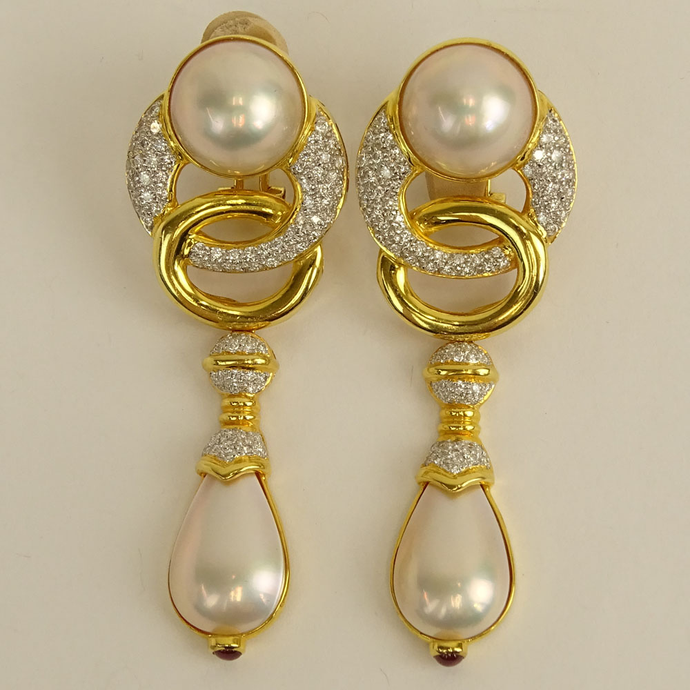 Pair of Mabe Pearl, Approx. 3.20 Carat Micro Pave Set Diamond and 14 Karat Yellow Gold Pendant Earclips.