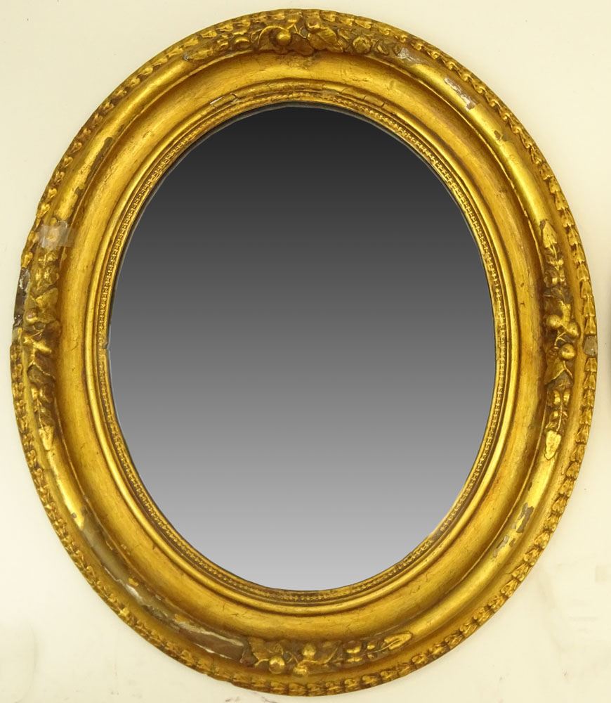 Pair of Gilt Carved Oval Mirrors.