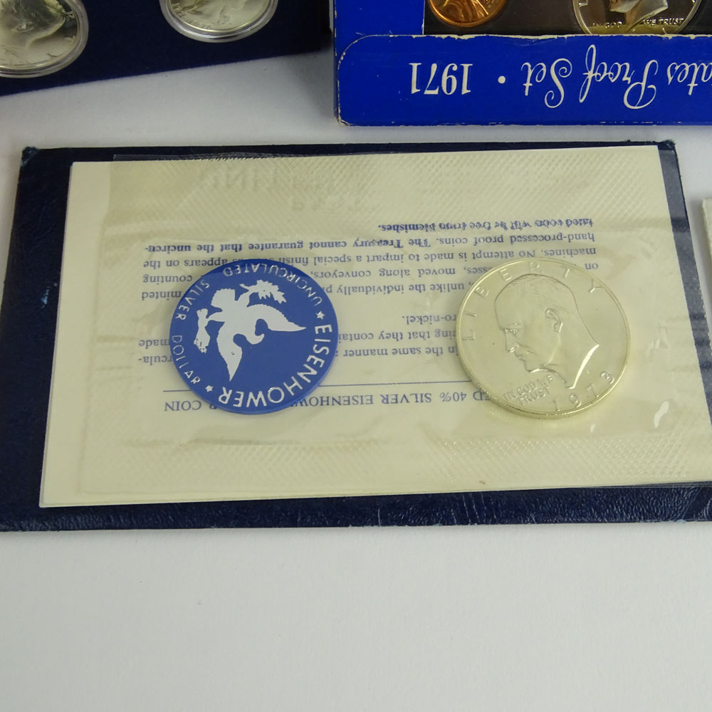 Collection US Proof Coin Sets and Uncirculated Eisenhower Dollar Coins.