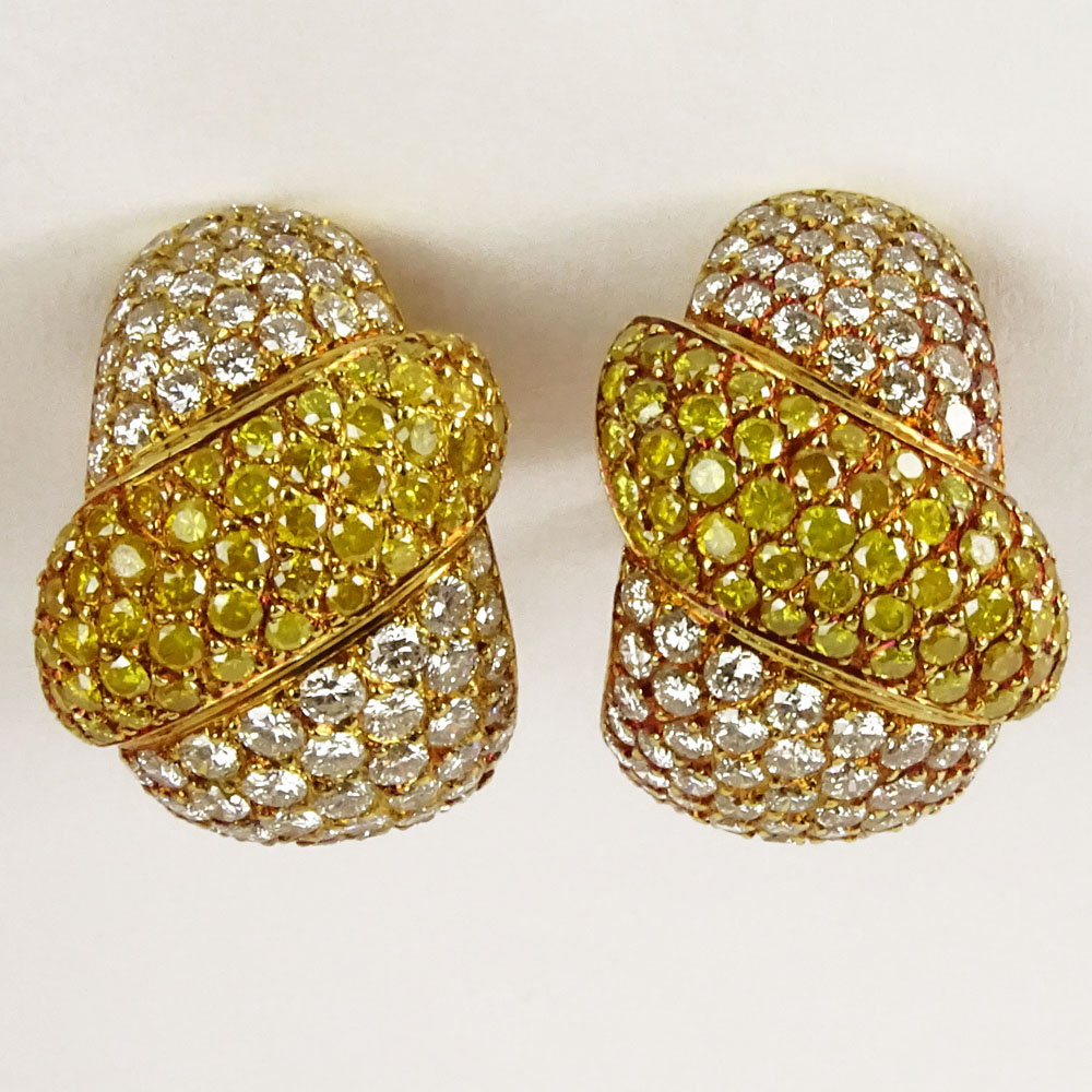 Lady's Approx. 8.50 Carat Fancy Yellow, Round Brilliant Cut Diamond and 18 Karat Yellow Gold Earrings.