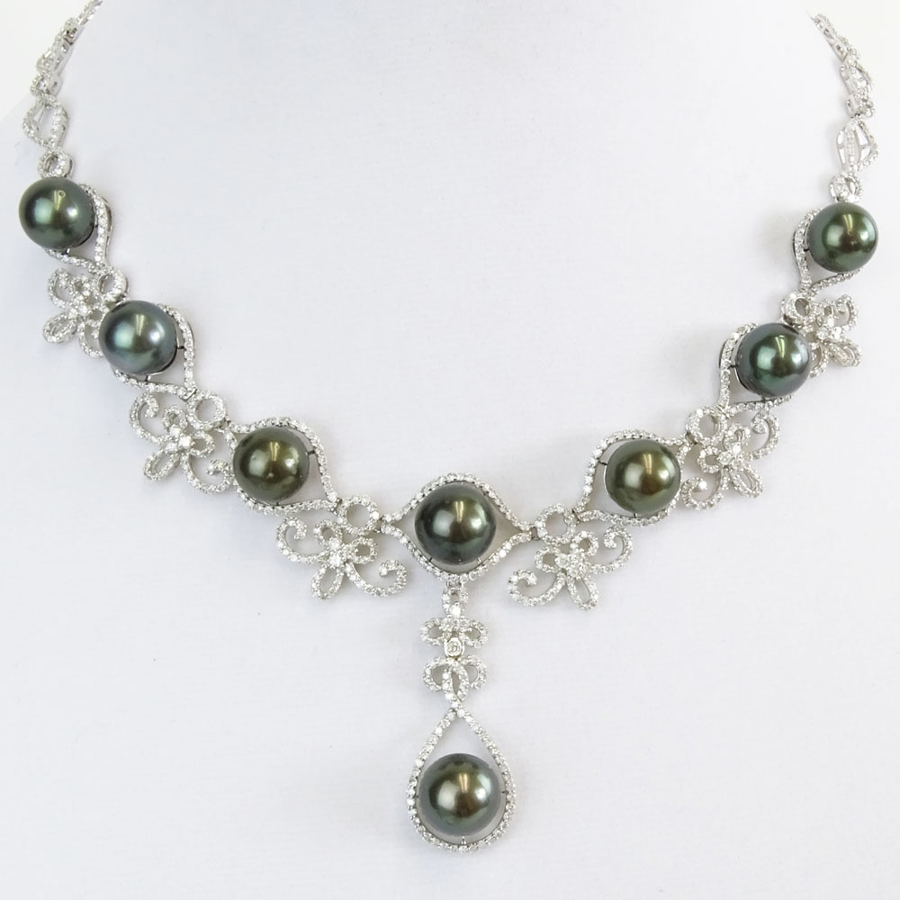 AIG Certified Eight (8) Tahitian Black Pearl, 10.68 Carat Round Brilliant Cut Diamond and 14 Karat White Gold Necklace. 