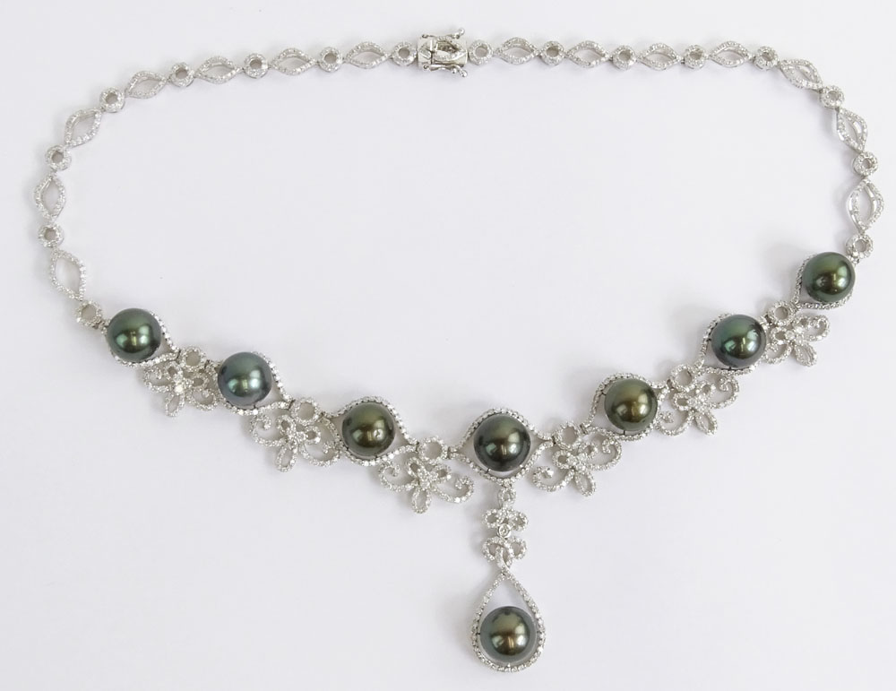 AIG Certified Eight (8) Tahitian Black Pearl, 10.68 Carat Round Brilliant Cut Diamond and 14 Karat White Gold Necklace. 