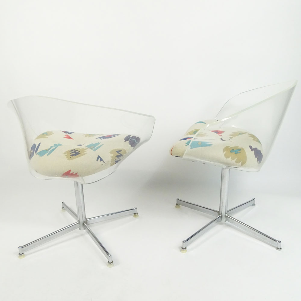 Pair of Mid Century Modern Lucite and Chrome Swivel Chairs.