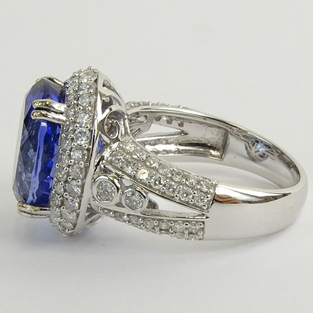 GIA and AIG Certified 8.87 Carat Oval Brilliant Cut Natural Tanzanite,1.44 Carat Round Brilliant Cut and Baguette Diamond and 14 Karat White Gold Ring.