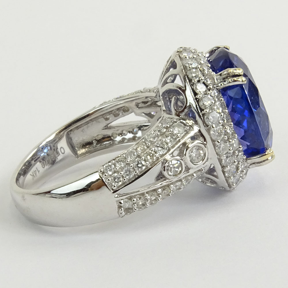 GIA and AIG Certified 8.87 Carat Oval Brilliant Cut Natural Tanzanite,1.44 Carat Round Brilliant Cut and Baguette Diamond and 14 Karat White Gold Ring.