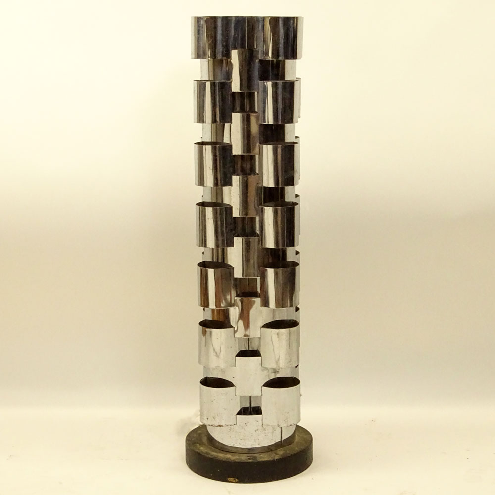 Curtis JerÈ, American (20th C) Chromed metal and ebonized wood tall floor lamp.