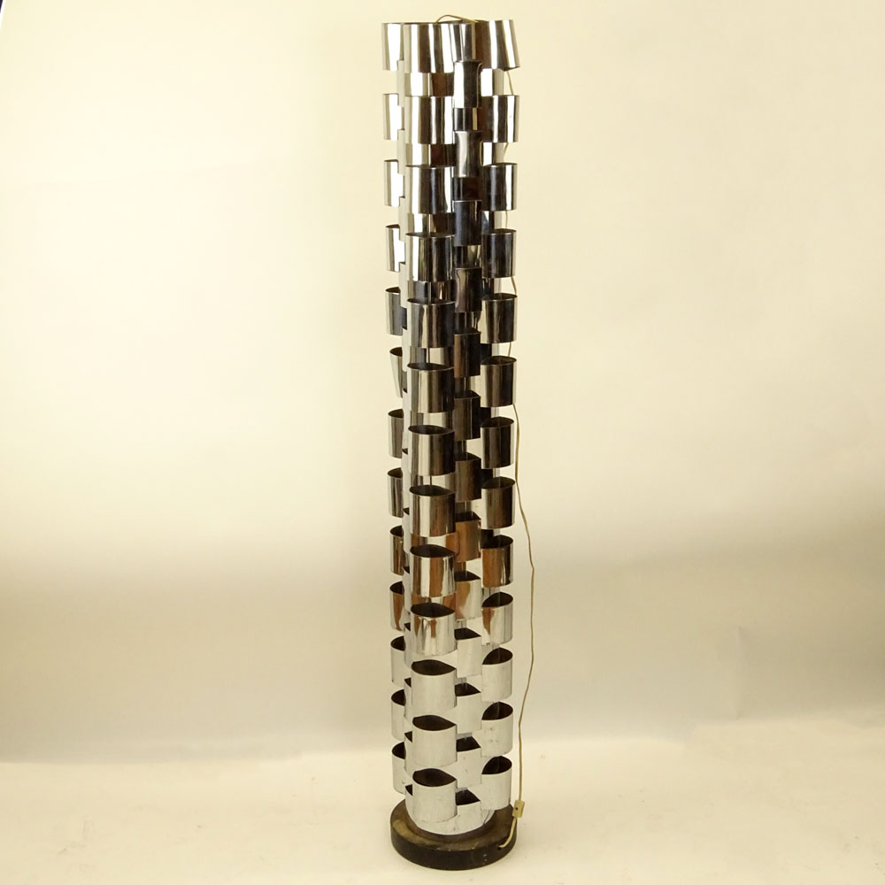 Curtis JerÈ, American (20th C) Chromed metal and ebonized wood tall floor lamp. 